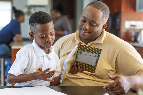 Father helping son with reading